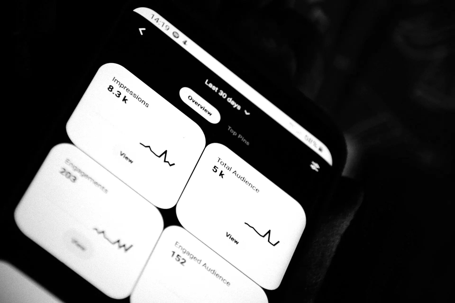 black smartphone showing white medication pill